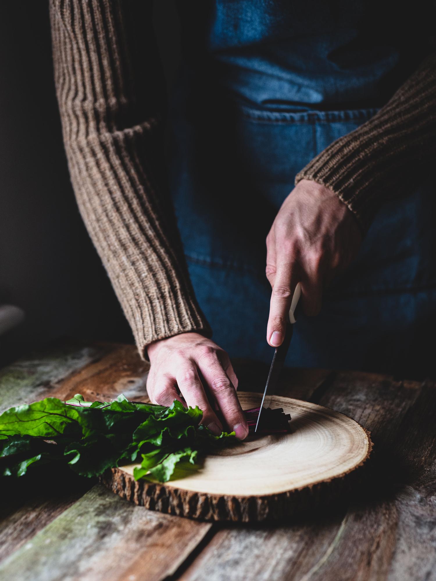 Chef preparing a rustic dish in a local kitchen